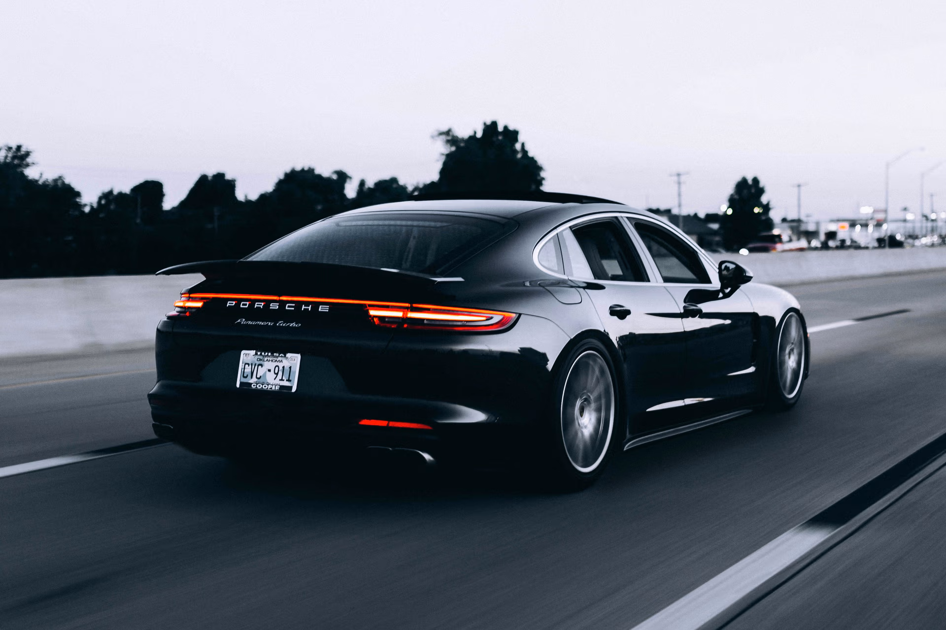 Editorial photograph of a Porsche on an open road; not a stock listing